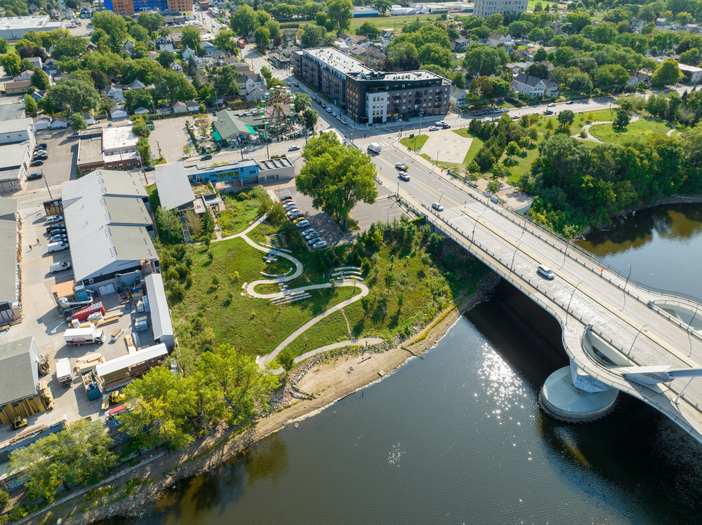 Video thumbnail image of an aerial view of a park and path alongside a river