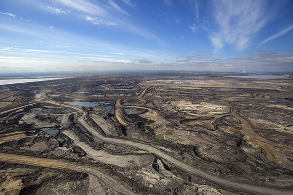 Expansive aerial view of a pit mining project in Alberta's oil sands near Fort McMurray.