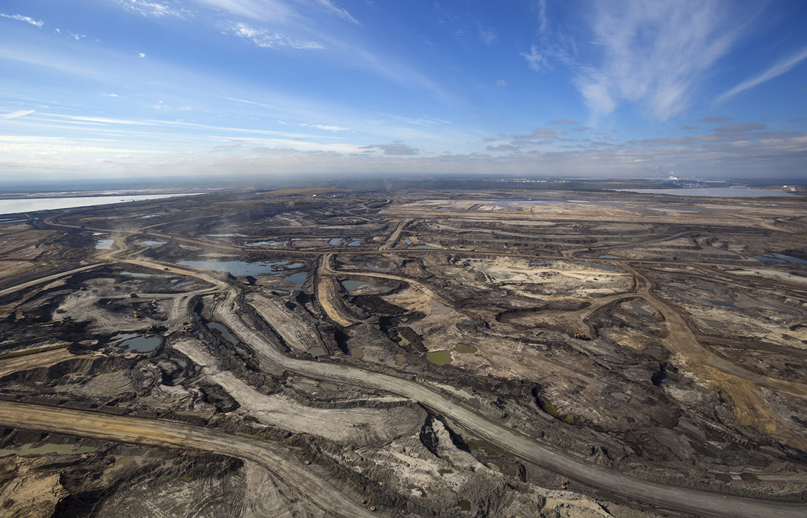 Expansive aerial view of a pit mining project in Alberta's oil sands near Fort McMurray.