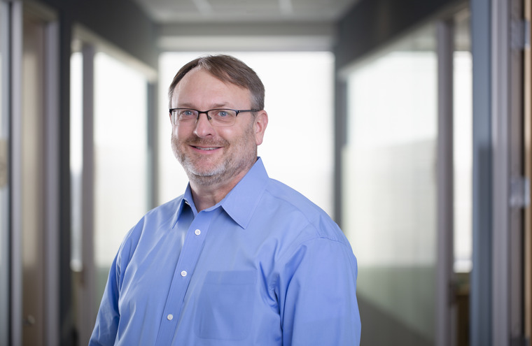 Employee headshot of Aaron Grosser