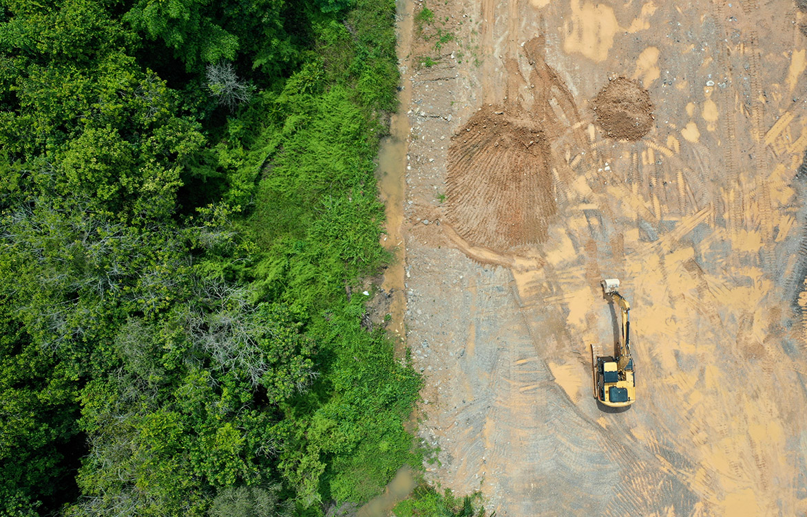 An aerial view of mined land. As a site for new infrastructure, mined land has a lot to offer, but potential risks lie hidden underground. Fortunately, targeted geotechnical assessments can uncover a mine’s history and reveal future risks to inform a safe, resilient design.