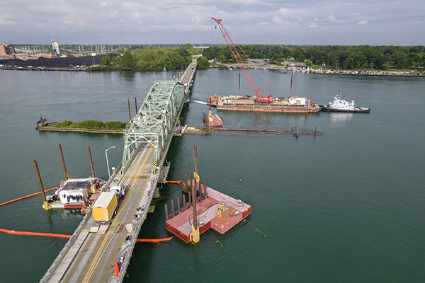 An overhead view of the Grosse Ile Parkway Bridge near Detroit, Michigan, during underwater pier repairs.