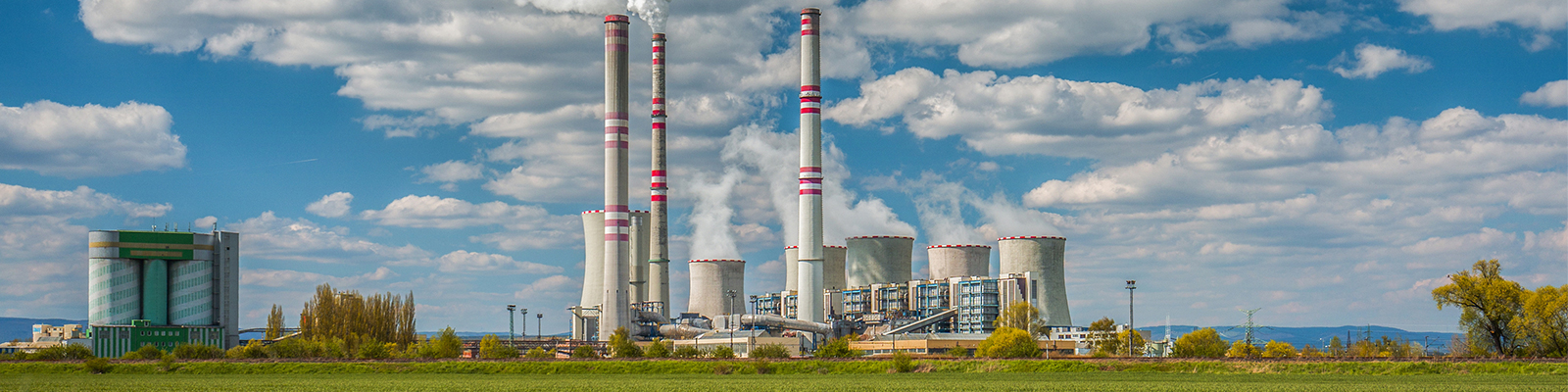 hero-image Coal plant in a field.