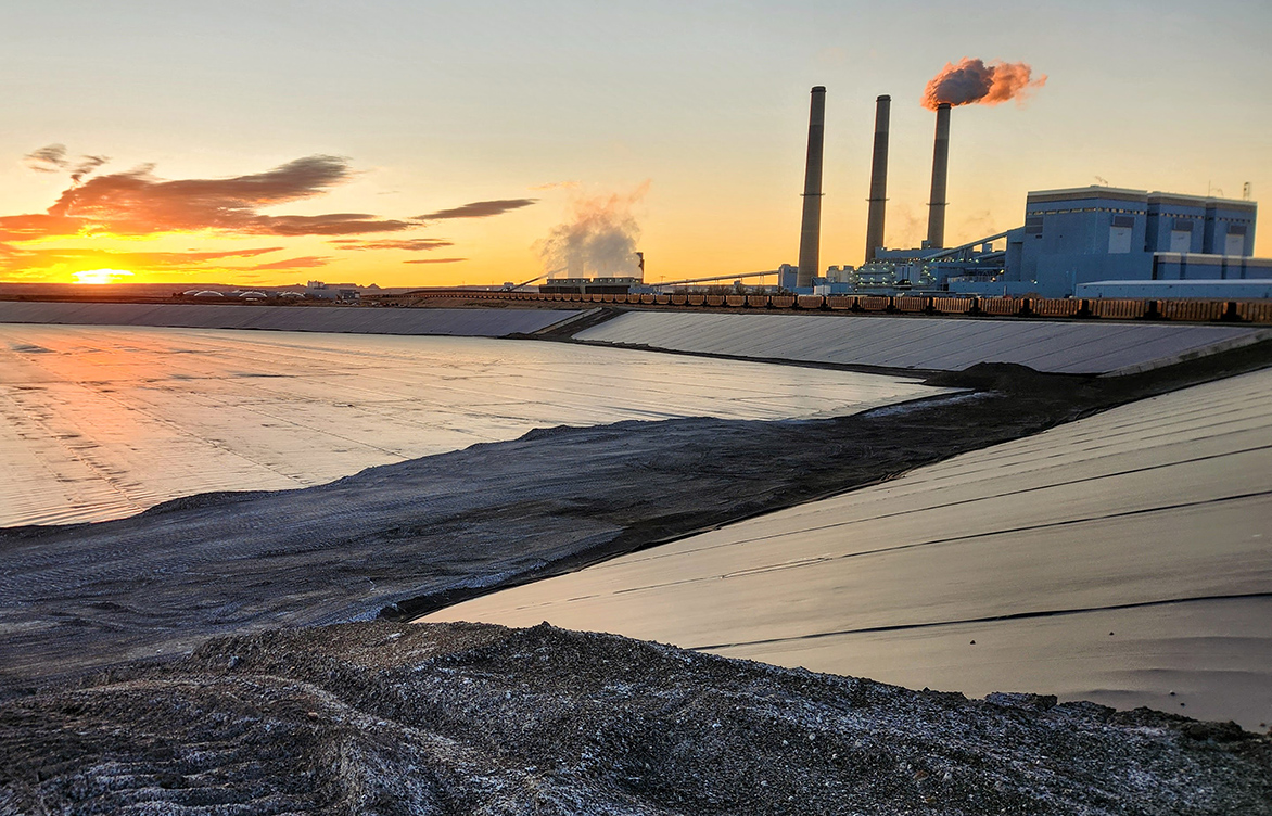 A major coal-fired power plant at sunset.