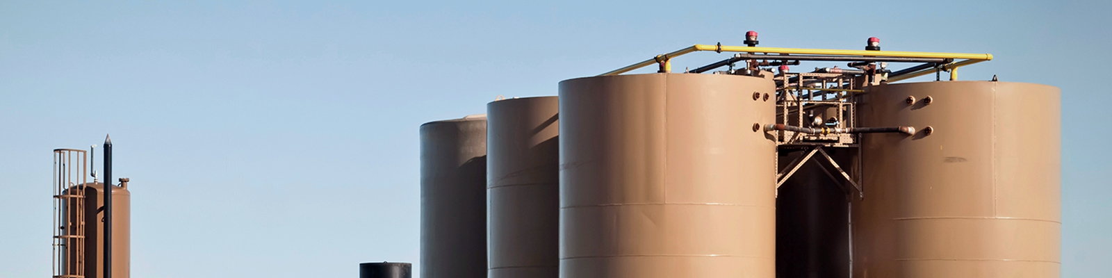 hero-image Storage tanks and treater for separating water from crude or condensate from natural gas.