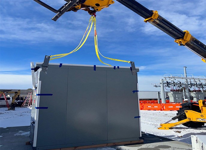 Electrical equipment secured to a crane at a substation in Colorado