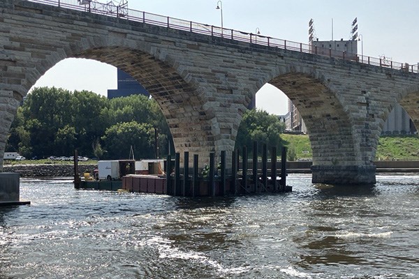 Flow diverter around the Stone Arch bridge to allow underwater repairs.