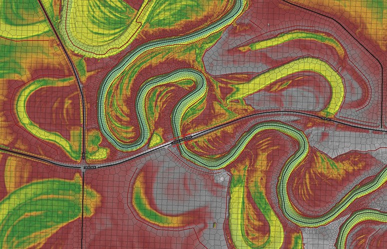 A graphical representation of a river reach, shown in a color gradient depicting relative elevation, with a mesh overlay representing the model domain.